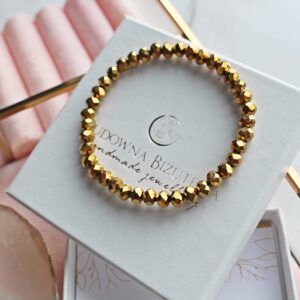 Bransoletka damska kryształowa w kolorze złotym